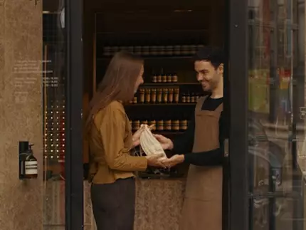 A hand care consultation in an Aesop store, beside a complimentary 15mL Eleos Aromatique Hand Balm offered upon email subscription.