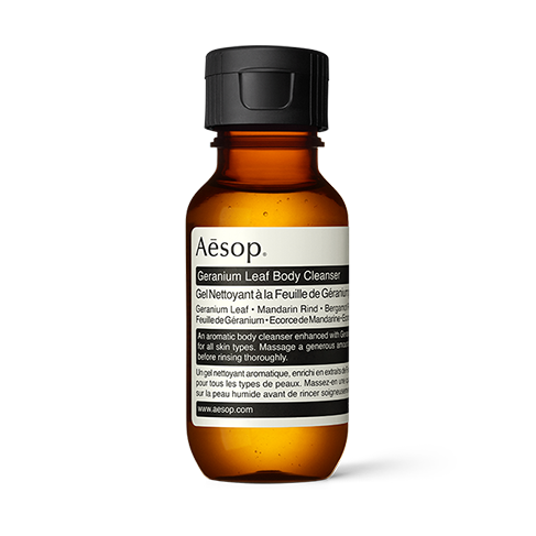 Product sample bottle with black cap on a light background.